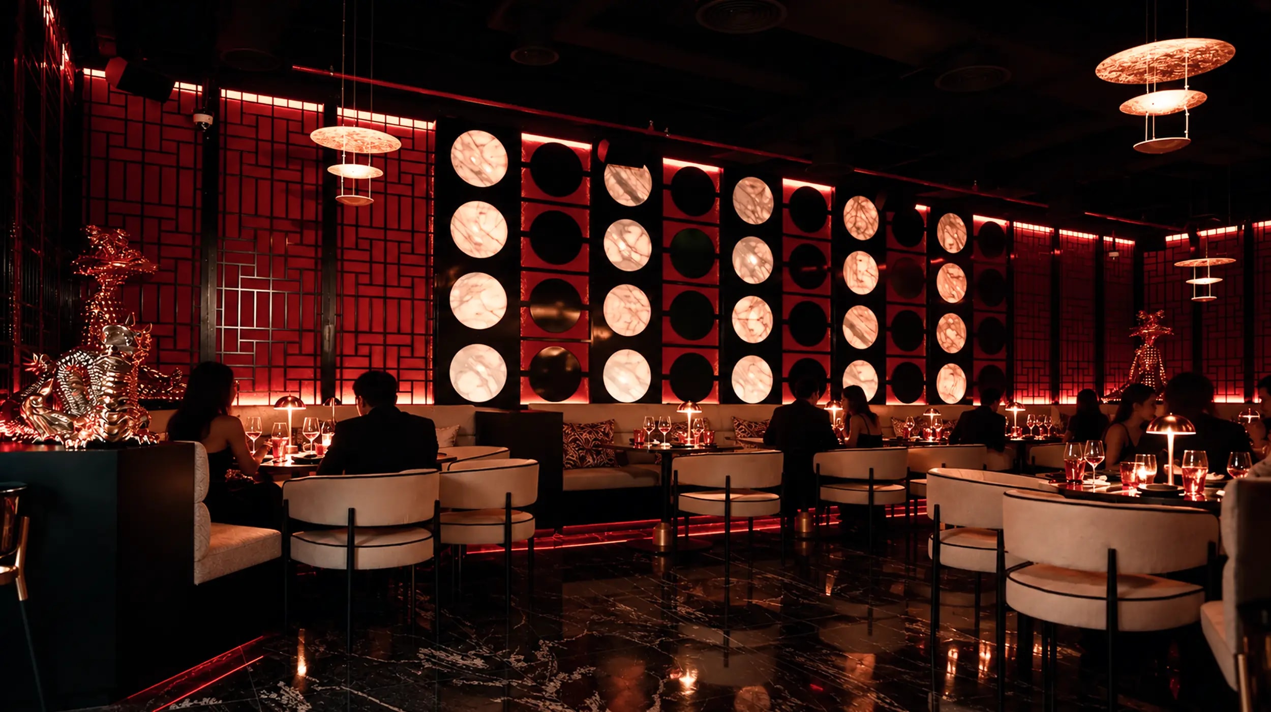 AKA Restaurant & Lounge dining room with red ambient lighting at Palm Jumeirah, Dubai